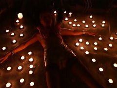 Busty girl surrounded by candles and get hot waxed