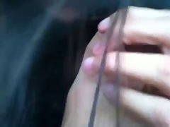 Latina teen sniffing and sucking her toes